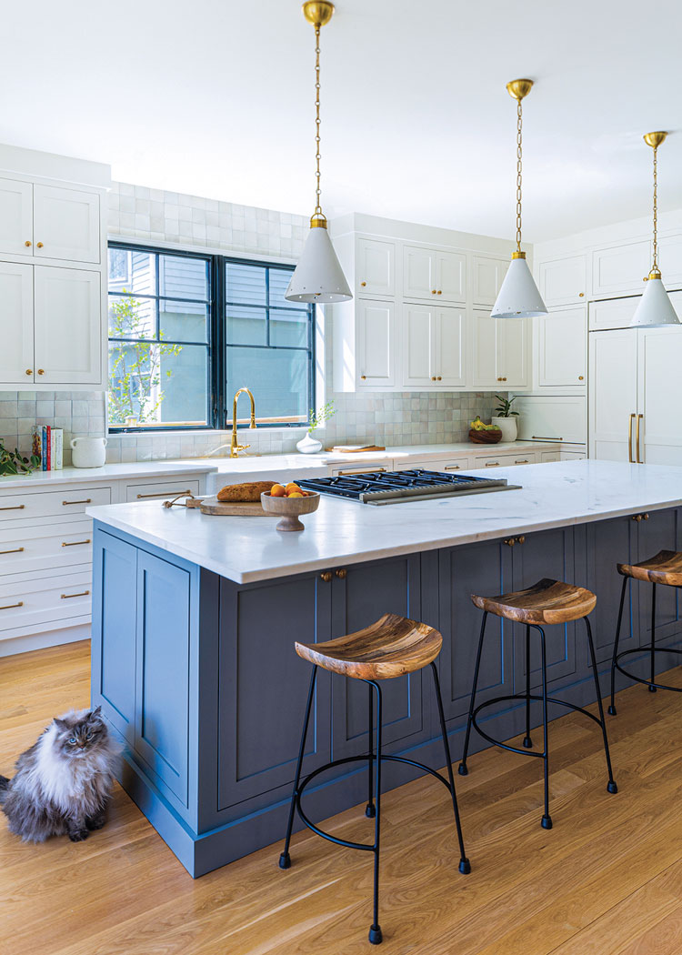 custom-made marble-topped island in renovated modern farmhouse style kitchen