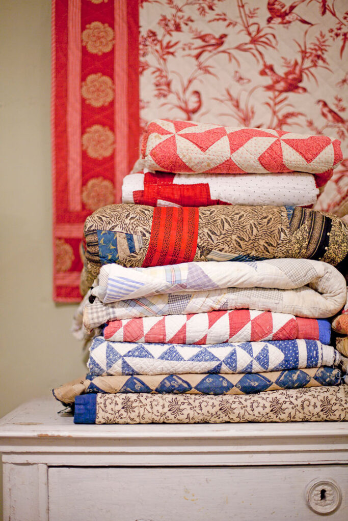 stack of quilts in red and blue palette