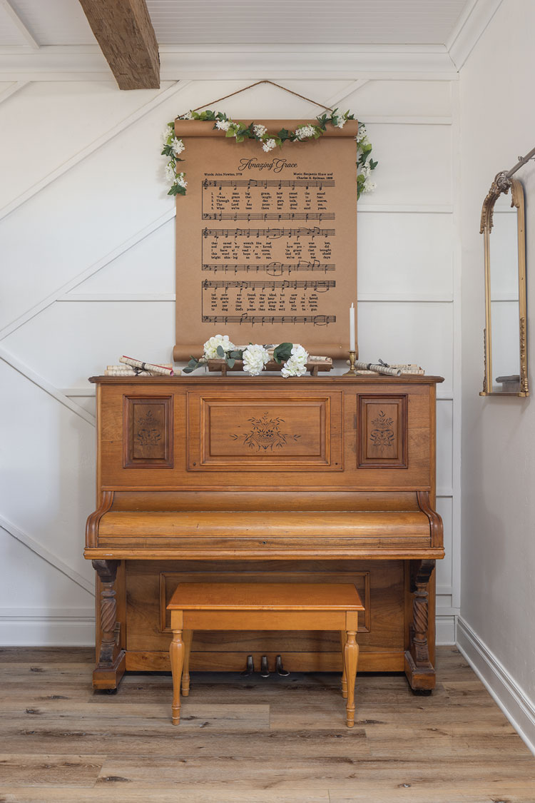 piano and scroll art with sheet music in modern farmhouse