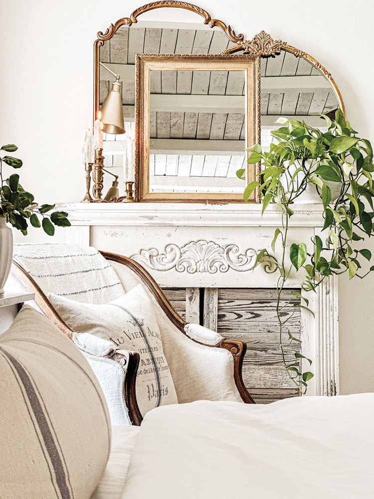 collection of mirrors resting on mantel in white sitting room