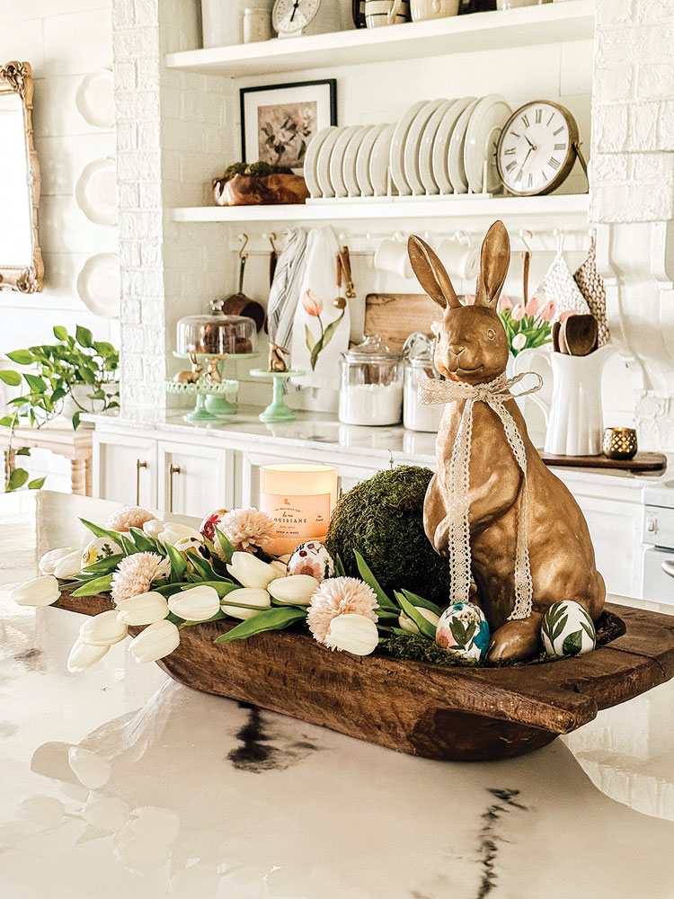 spring centerpiece with gold bunny figurine and white tulips