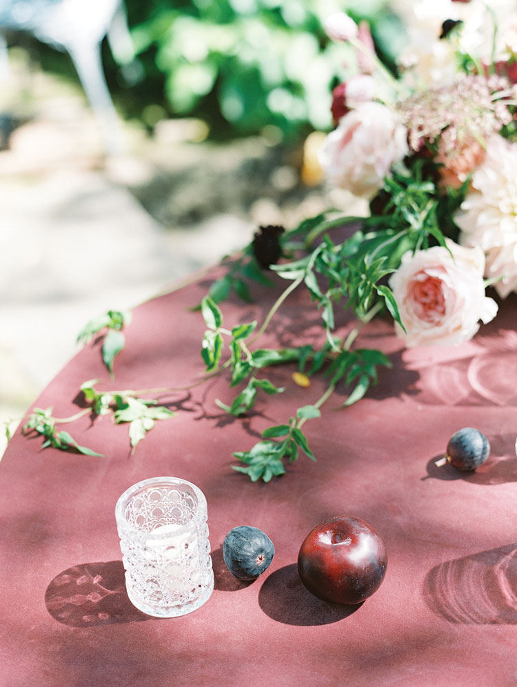 romantic tablescape with flowers and fruit