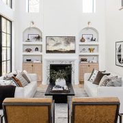modern farmhouse living room with black paned window frame and rounded wall cutouts