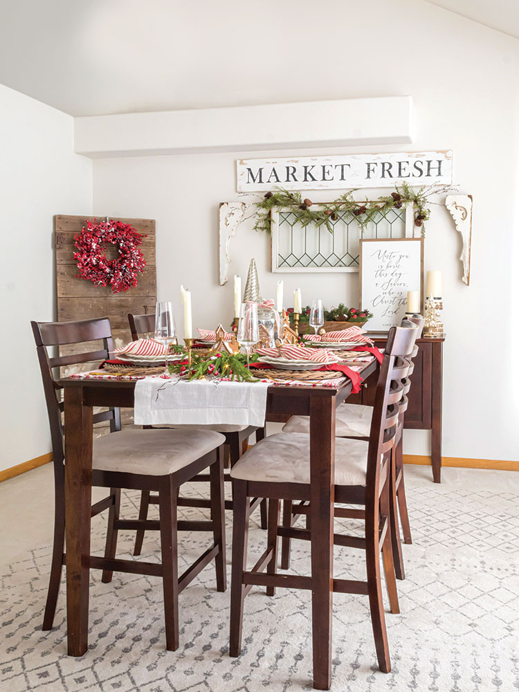 holiday dining room table with red white and gingerbread theme