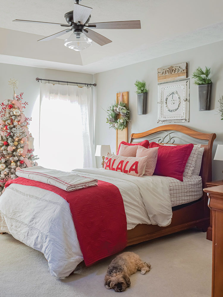 holiday bedroom with Christmas tree and red and white theme