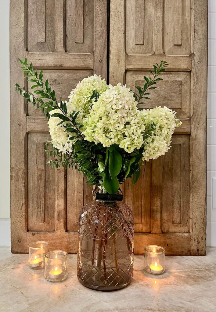 antique glass bottle used as flower vase