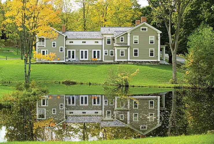 eyebrow windows on spacious New England farmhouse