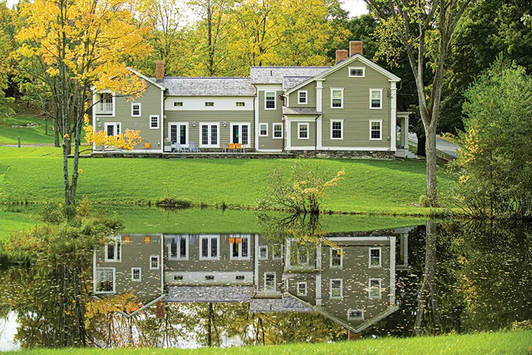 eyebrow windows on spacious New England farmhouse