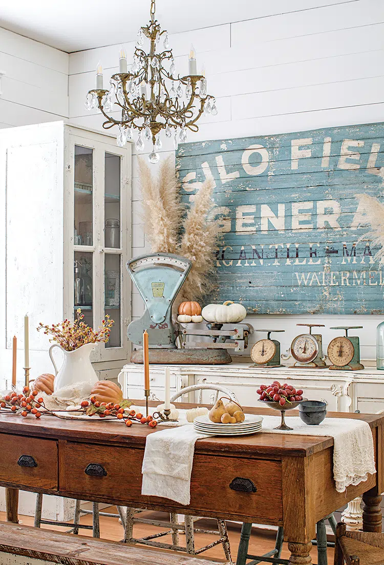 vintage kitchen scale and large vintage signs in Florida home decorated for fall