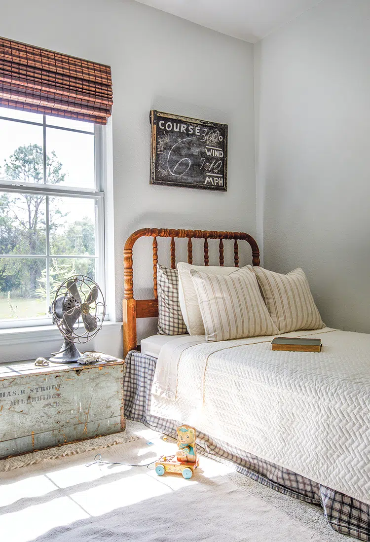 kid's room with bedframe and vintage fan and chest