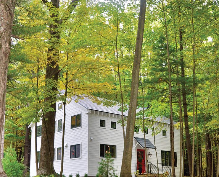 exterior view of renovated old barn home surrounded by western Michigan trees