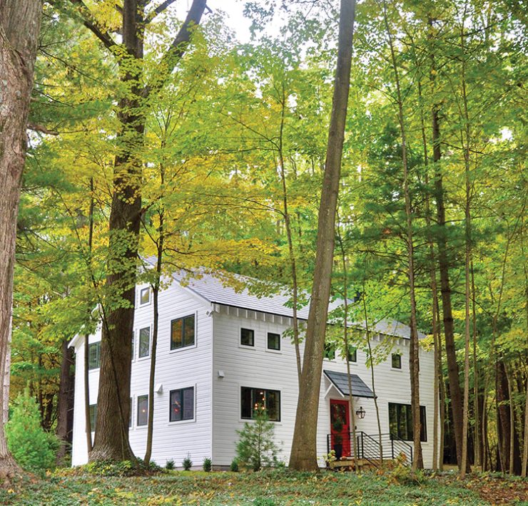 exterior view of renovated old barn home surrounded by western Michigan trees