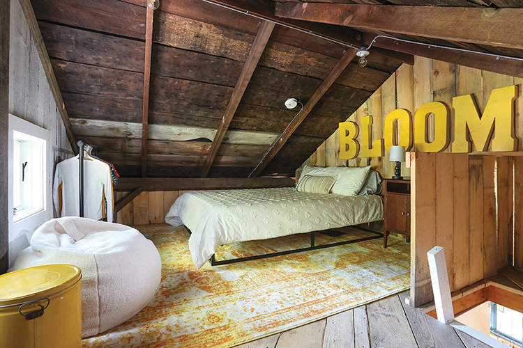 attic room with salvaged letters and other yellow accents