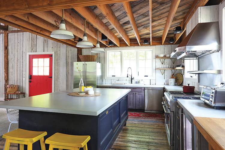 renovated barn home kitchen with salvaged wood and modern appliances