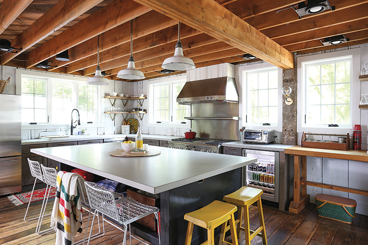 kitchen in renovated old barn with smart technology such as beer fridge