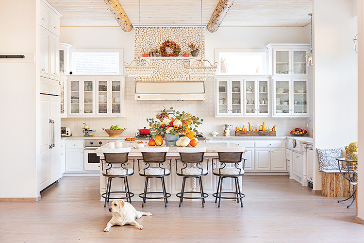 stone detail above oven hood in white kitchen in Big Bear farmhouse cabin