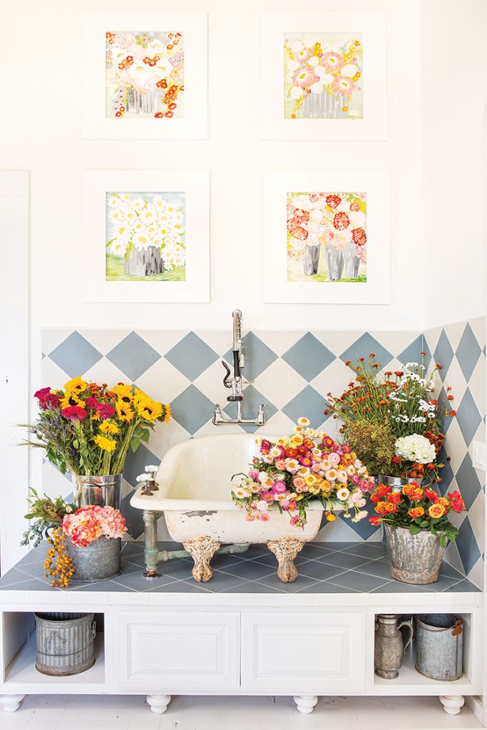 sink surrounded by fresh flowers for arranging