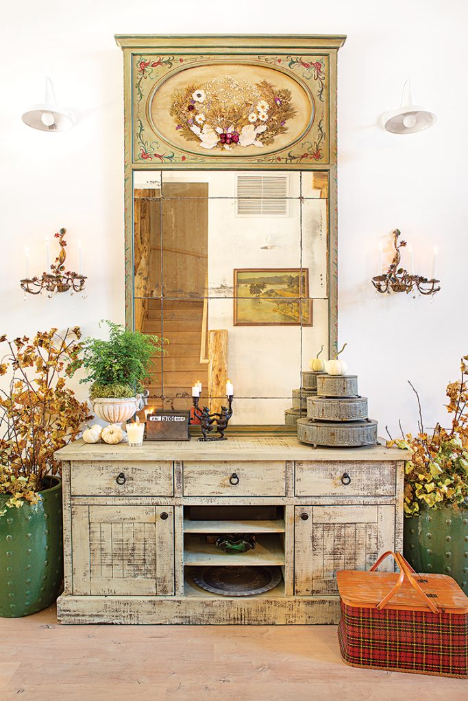 vintage picnic basket and mirror in fall cabin