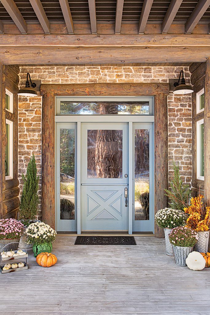 entryway to Big Bear farmhouse cabin with mums and pumpkins