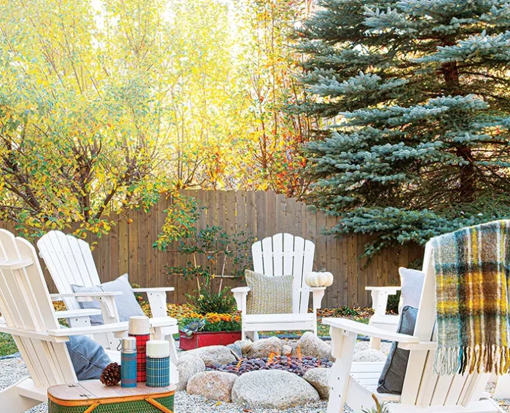 vintage thermoses in outdoor fire ring with wooden chairs