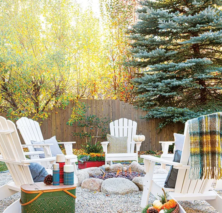 vintage thermoses in outdoor fire ring with wooden chairs