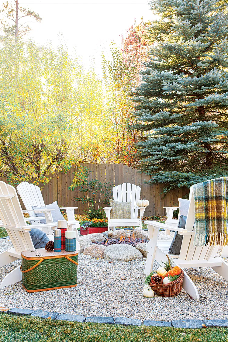 vintage thermoses in outdoor fire ring with wooden chairs