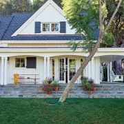 exterior of authentic farmhouse in Ojai with white siding and dark blue shutters