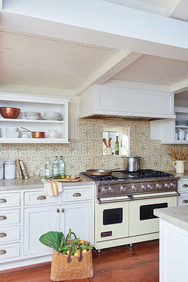 kitchen with hand-painted backsplash tile and exposed shelves