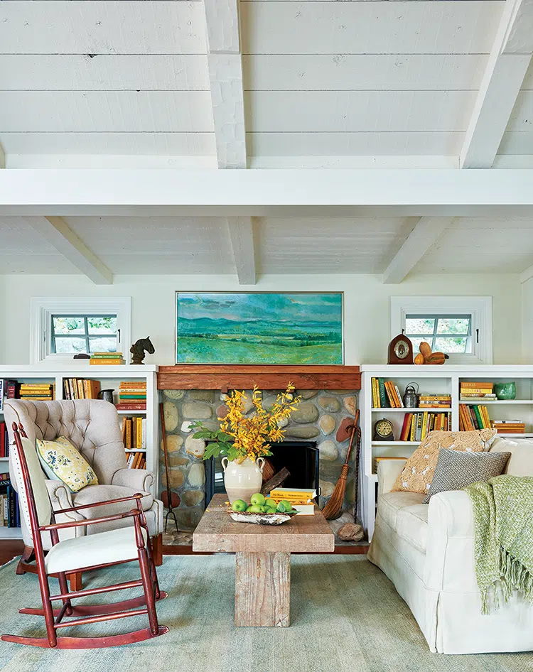 sitting room with antique stone fireplace and rocking chair in authentic farmhouse in Ojai