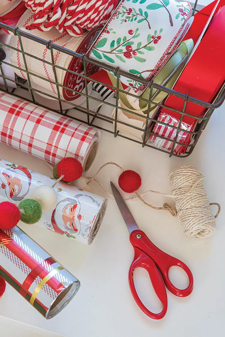 red and green felt garland and Christmas gift wrapping supplies