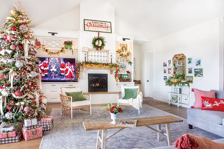 living room in vintage home at Christmastime with Christmas tree and White Christmas on TV