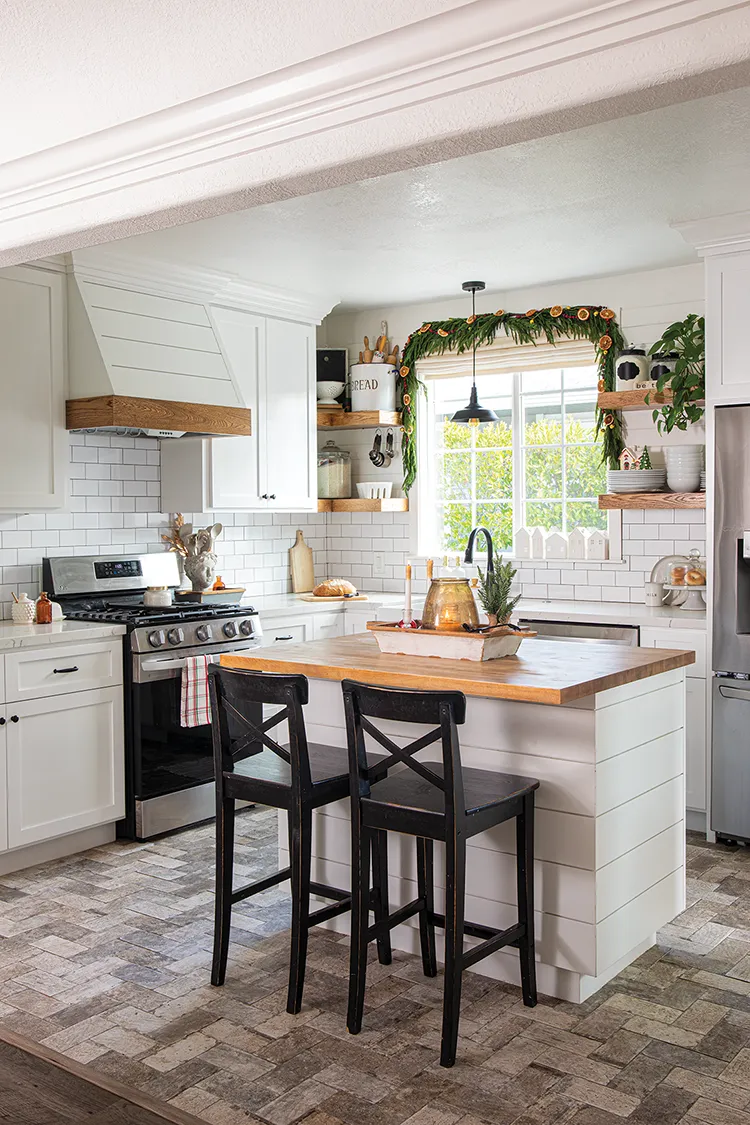 kitchen with vintage cottage style Christmas decorations such as natural garland with dried oranges