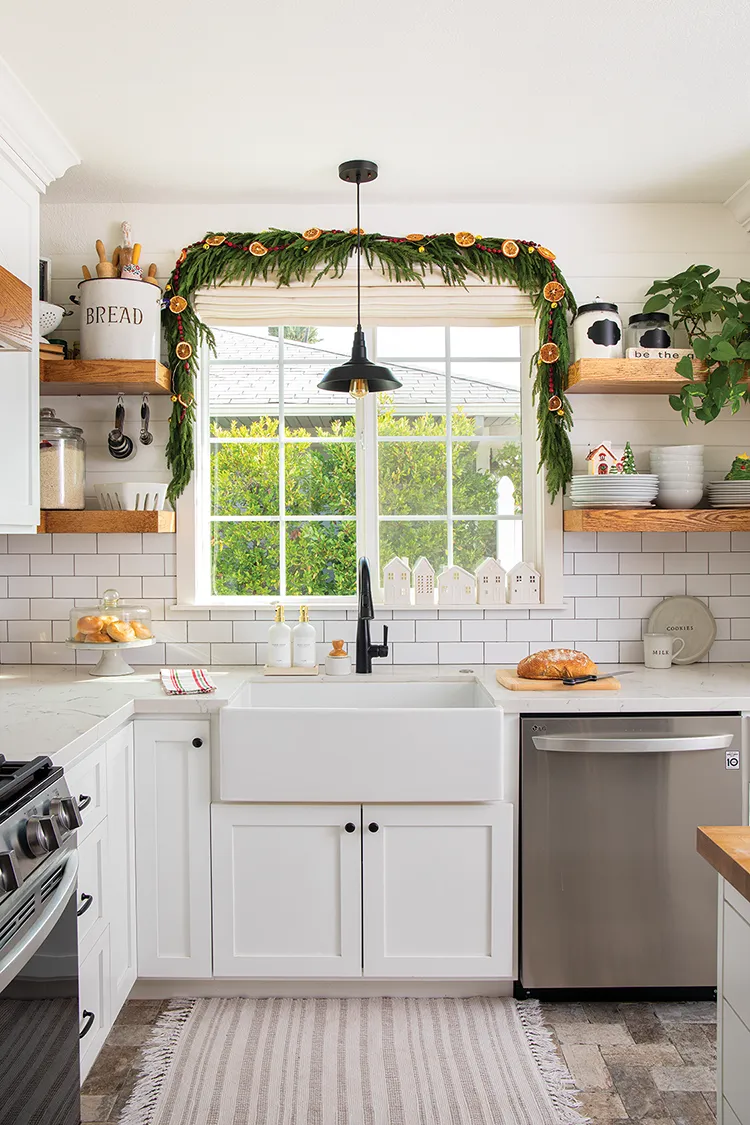 white farmhouse kitchen with fresh garland with dried citrus rounds