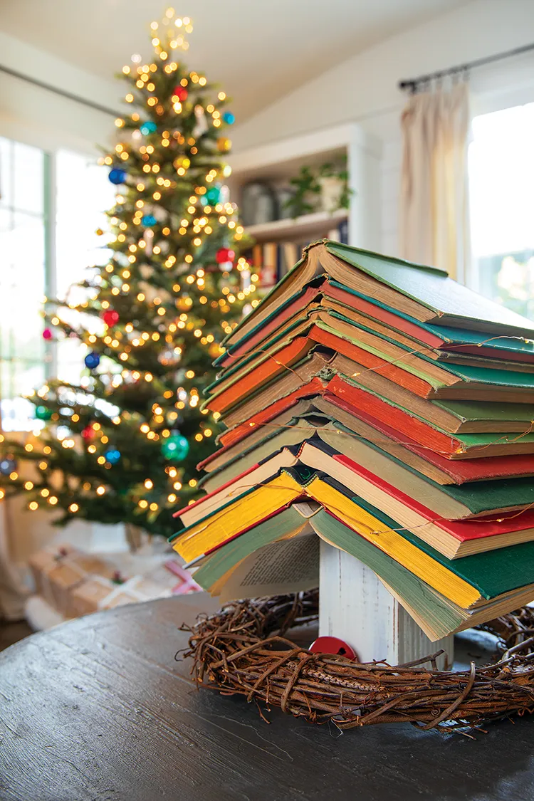 stack of vintage and antique books form a tree shape