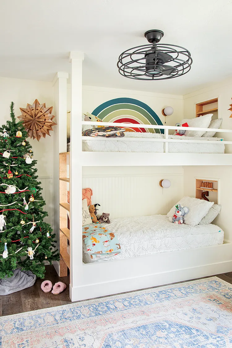 kids room with vintage fan and tree next to bunk beds