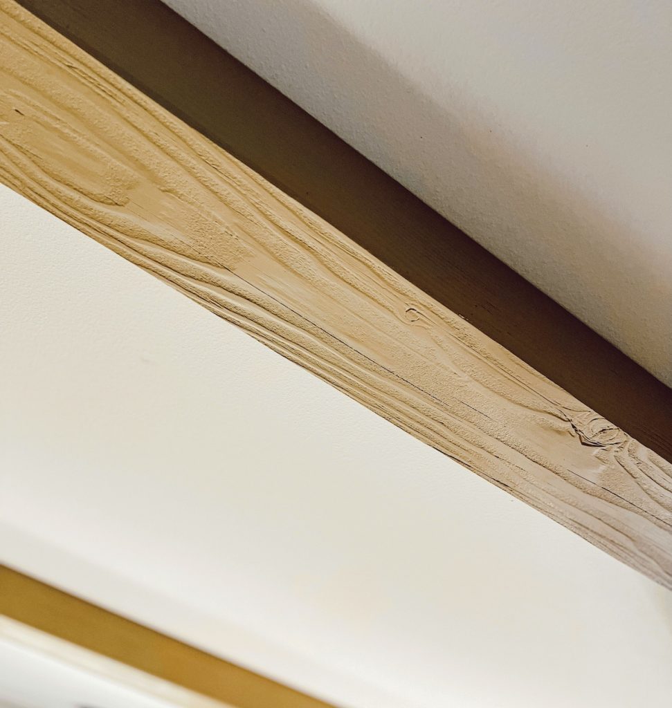 close up of faux wood beam on ceiling