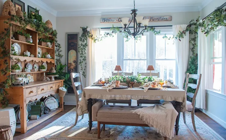 winter tablescape with beige and cream tablecloth and layered place settings