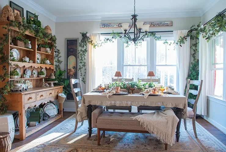 winter tablescape with beige and cream tablecloth and layered place settings