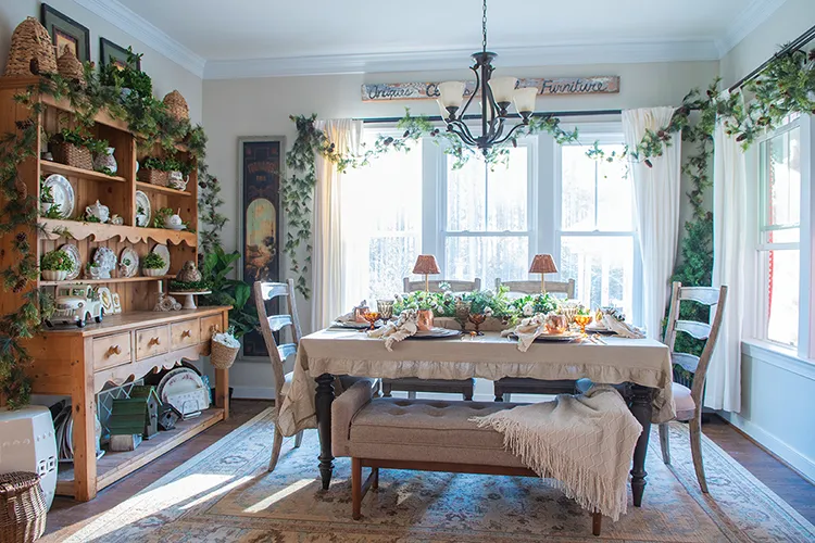 winter tablescape with beige and cream tablecloth and layered place settings