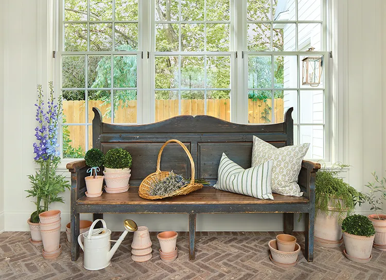 vintage bench and traditional terracotta potting plants in Project House Utah