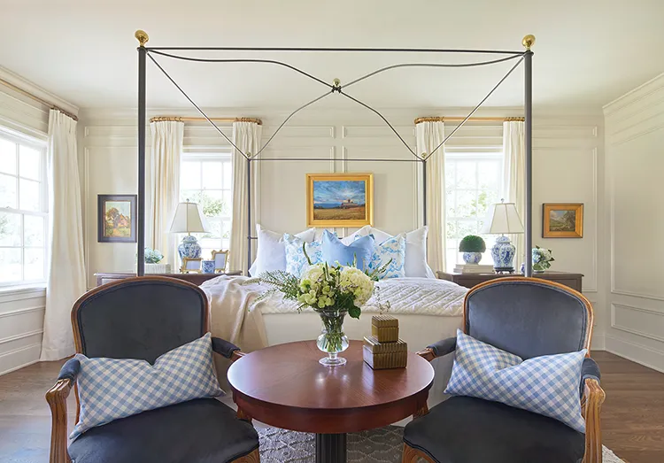 seating area at the foot of bed in bedroom of Project House Utah