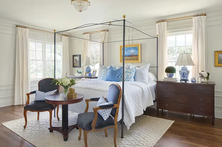 bedroom with canopy bed and luxurious rug in Project House Utah