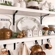 kitchen close up of exposed kitchen shelves with copper and white kitchenalia