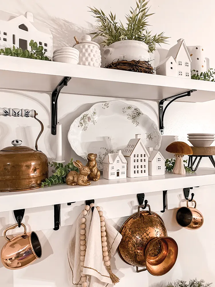 kitchen close up of exposed kitchen shelves with copper and white kitchenalia