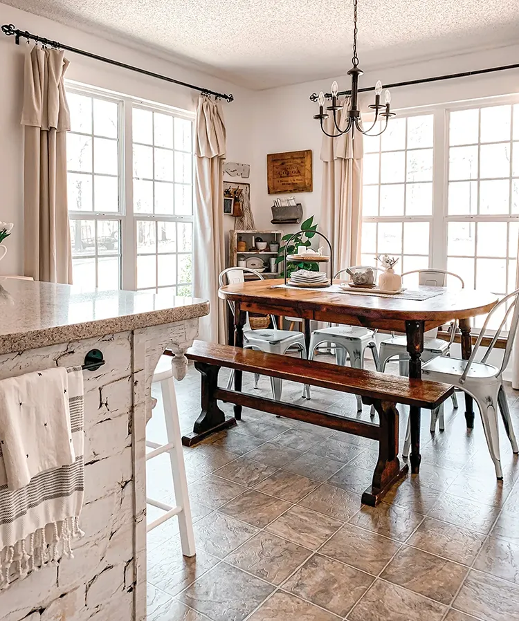 dining table with bench and metal chairs in home of Lynn Langford 2025 Brand Ambassador