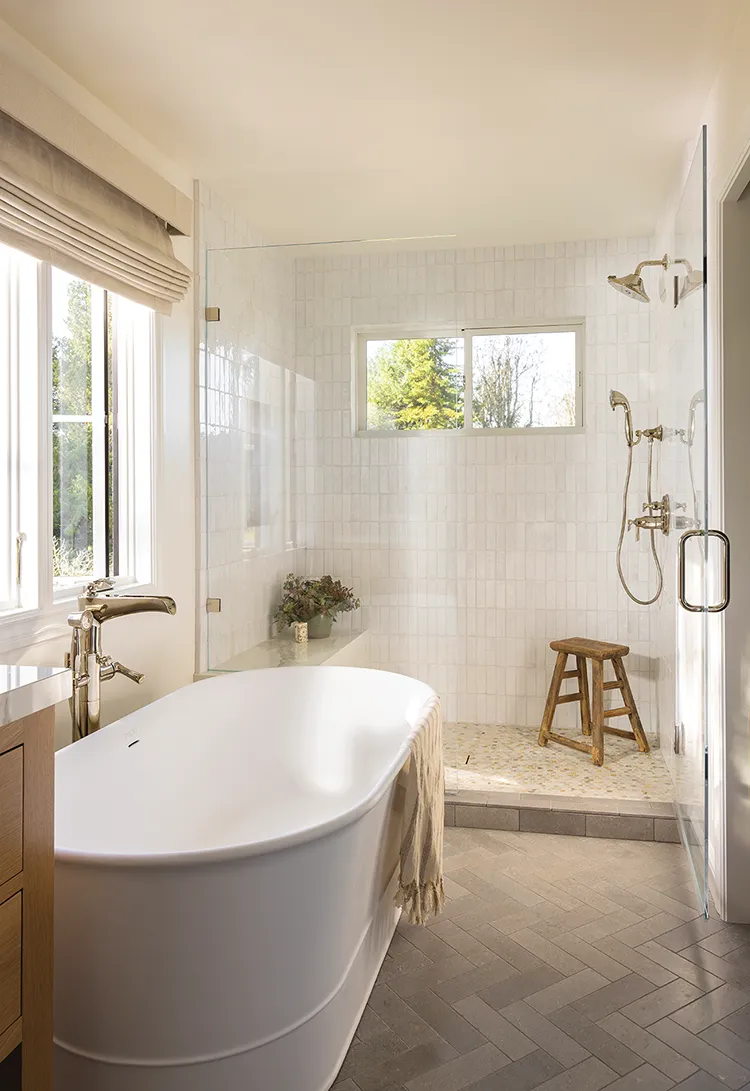 master bathroom with soaking tub and neutral color scheme