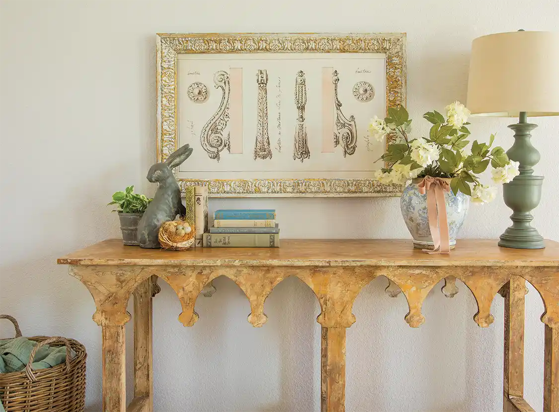 spring vignette with French country vibes with vintage drawing and table