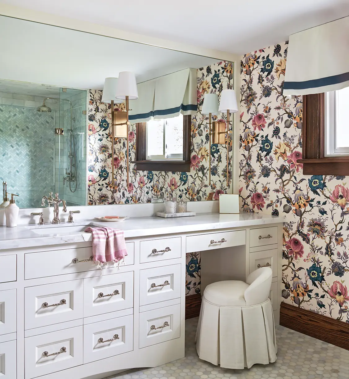 floral wallpaper in bathroom with built-in vanity station