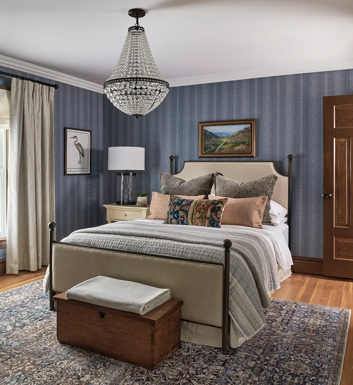 stripped blue-gray wallpaper and framed bird print in Victorian farmhouse bedroom