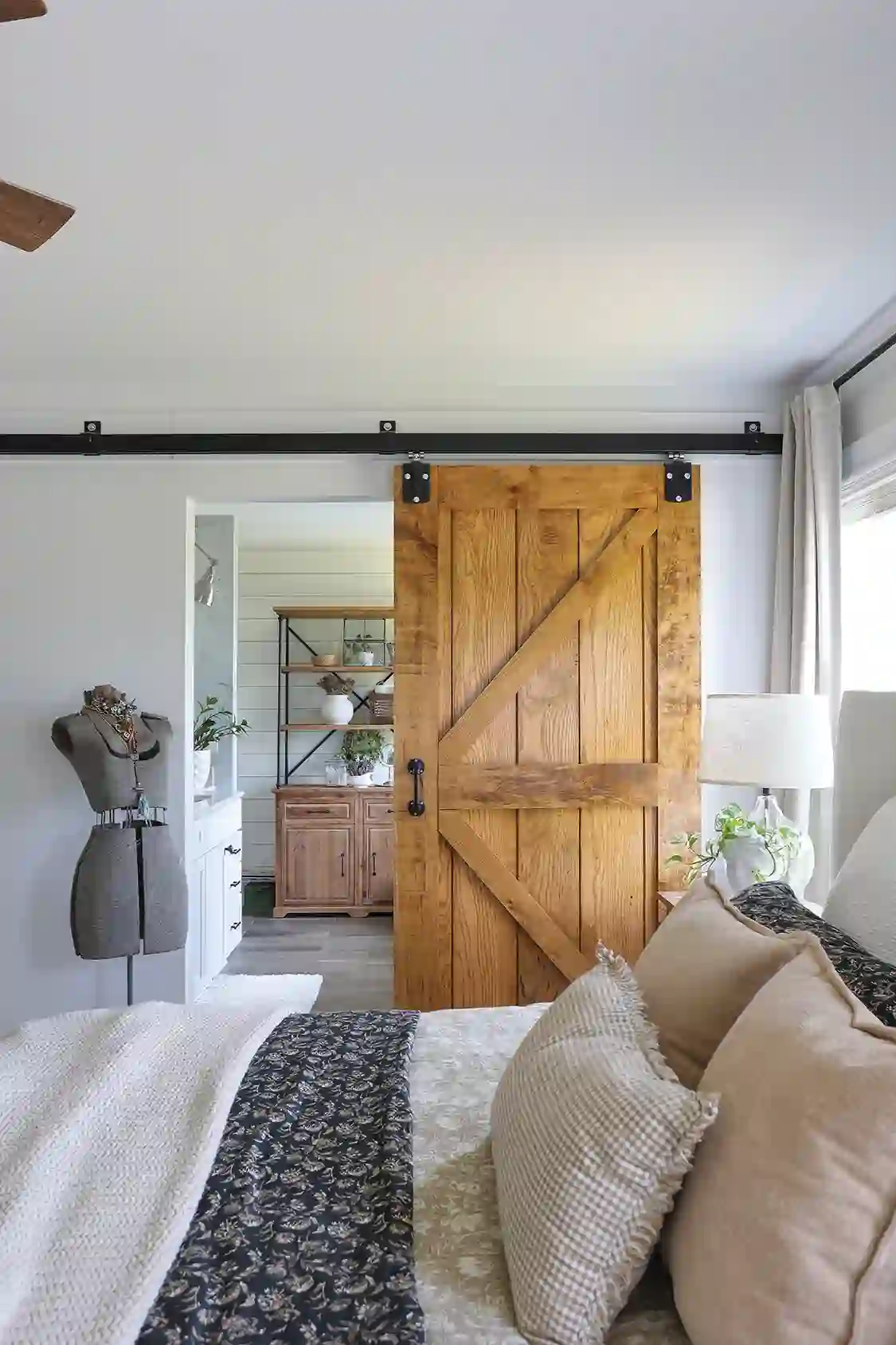 sliding barn door partitions bedroom in expansive dream home